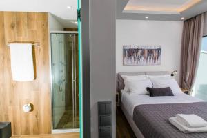 A bed or beds in a room at Chrysi's Ocean View Retreat