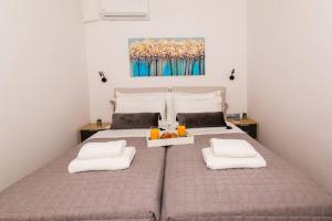 A bed or beds in a room at Chrysi's Ocean View Retreat