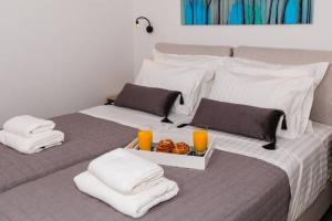 A bed or beds in a room at Chrysi's Ocean View Retreat