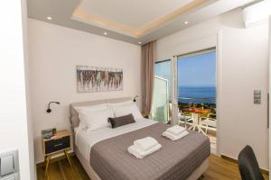 A bed or beds in a room at Chrysi's Ocean View Retreat