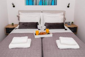A bed or beds in a room at Chrysi's Ocean View Retreat