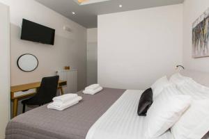 A bed or beds in a room at Chrysi's Ocean View Retreat