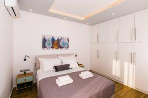 A bed or beds in a room at Chrysi's Ocean View Retreat