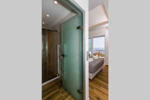 A bed or beds in a room at Chrysi's Ocean View Retreat