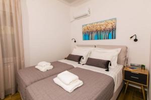 A bed or beds in a room at Chrysi's Ocean View Retreat