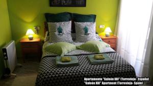 Łóżko lub łóżka w pokoju w obiekcie Apartamento Galeon XXI