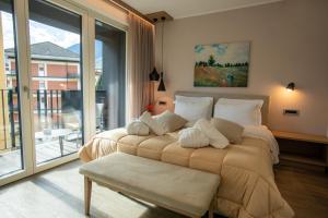 Posteľ alebo postele v izbe v ubytovaní Residence Villa Hedy