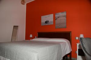 A bed or beds in a room at Le rose di Bino