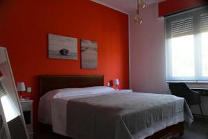 A bed or beds in a room at Le rose di Bino