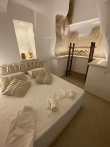 Кровать или кровати в номере SALENTO NONNI