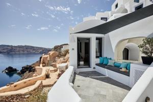 a villa with a view of the water at Blue Art Caves in Oia