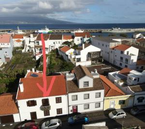 an aerial view of a town with a red roof at Apartamentos Garrett in Horta