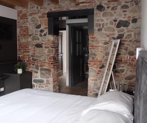 A bed or beds in a room at Hotel Dal Menga