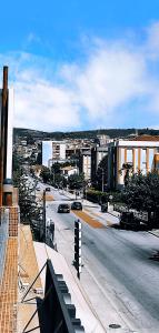 a view of a city with a street and buildings at Residencial Douro in Peso da Régua