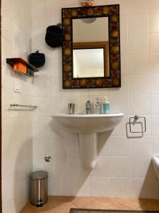 a bathroom with a sink and a mirror on the wall at Dimora dei saraceni in Marina di Pisticci +44 photos