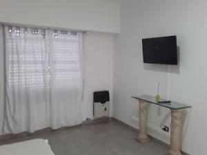 TV/trung tâm giải trí tại Departamento centrico con cochera