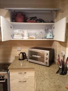 Η κουζίνα ή μικρή κουζίνα στο Luxury Inn Madinaty25C +15 φωτογραφίες