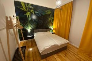 เตียงในห้องที่ Stylowy apartament tuż przy Rynku