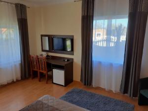 Telewizja i/lub zestaw kina domowego w obiekcie GRAND VILLA USTKA- Marmonoli