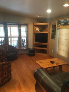 a living room with a couch and a coffee table at Riverbend Resort in South Fork