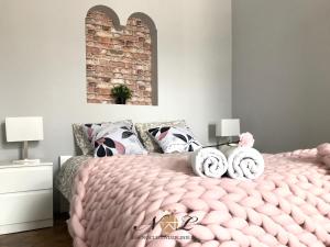 Posteľ alebo postele v izbe v ubytovaní Apartament Peowiaków Superior