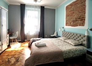 Posteľ alebo postele v izbe v ubytovaní Apartament Peowiaków Superior