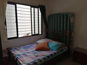 a bedroom with a bed with a large window at Villas de Santa Ana in Guamo