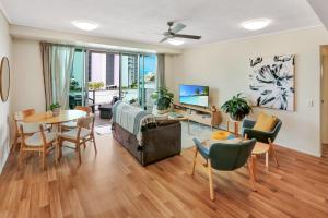 a living room with a couch and a table at The Harbour View Condo in Cairns