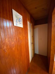 a hallway with a bike picture on the wall at Depto N°1 Temuco Centro in Temuco