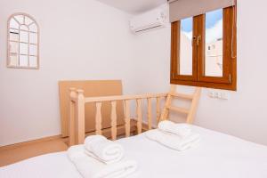 Postel nebo postele na pokoji v ubytování Whitelist Maisonette I and II in Mykonos Town