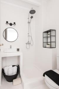 a bathroom with a sink and a mirror at Whitelist Loft in Mykonos Town in Megali Ammos