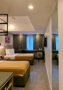 Postel nebo postele na pokoji v ubytování JET Hotel