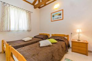 Posteľ alebo postele v izbe v ubytovaní Villa Dubrovnik Chalets + 37 fotografií