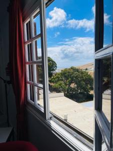 an open window with a view of a patio at CASA RURAL GA7COLORES only adult in Montaña Blanca