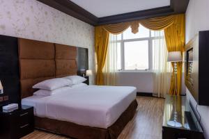 Postel nebo postele na pokoji v ubytování Mangrove Hotel