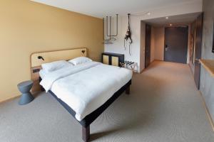 Postel nebo postele na pokoji v ubytování ibis Styles Bayreuth