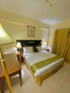 Кровать или кровати в номере Al Nakheel Hotel Apartments