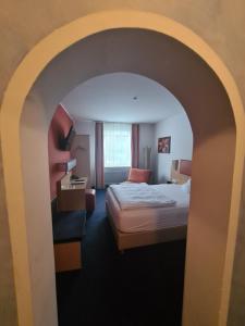 Postel nebo postele na pokoji v ubytování Hotel Silberhorn