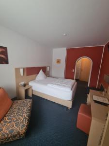 Postel nebo postele na pokoji v ubytování Hotel Silberhorn