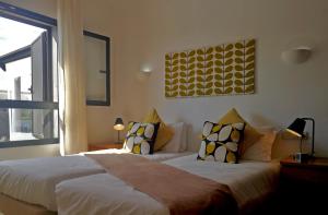 A bed or beds in a room at Casa Amelia
