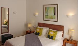 A bed or beds in a room at Casa Amelia