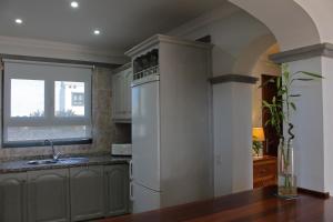 A kitchen or kitchenette at Casa Amelia