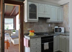 A kitchen or kitchenette at Casa Amelia