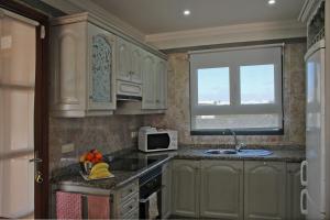 A kitchen or kitchenette at Casa Amelia