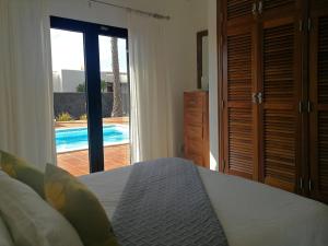 A bed or beds in a room at Casa Amelia
