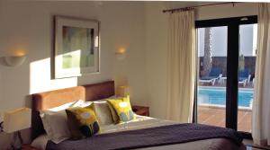 A bed or beds in a room at Casa Amelia