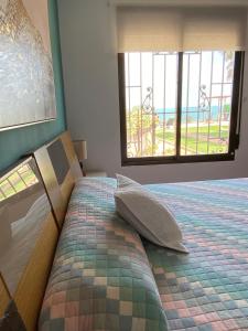 Posteľ alebo postele v izbe v ubytovaní Villa 1 linea de playa