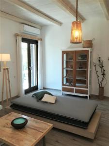 a room with a large mattress on the floor at Almira Kalamos in Kalamos
