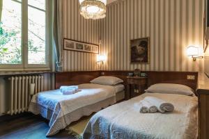 Ліжко або ліжка в номері Villa Rondinella - Tremezzina