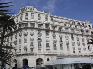 a large white building with a lot of windows at Cannes, la Croisette, Palais Miramar in Cannes